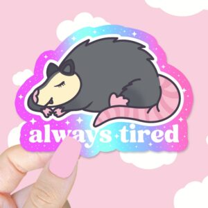 A graphic of Always Tired Possum Sticker available on HeckinMagical.com