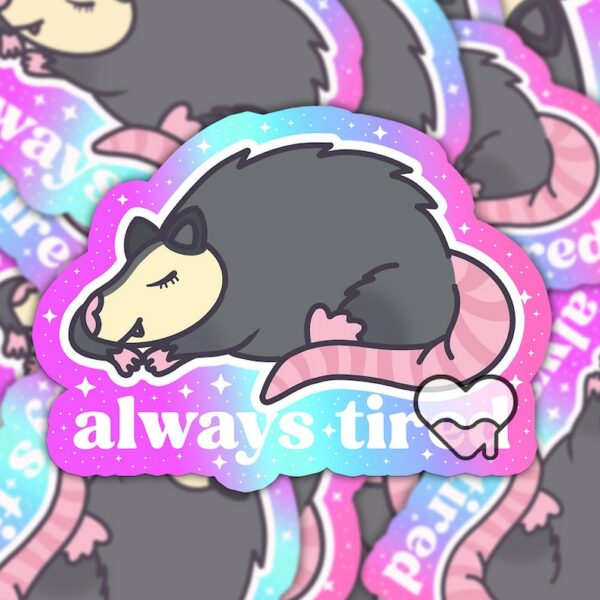 A graphic of Always Tired Possum Sticker available on HeckinMagical.com