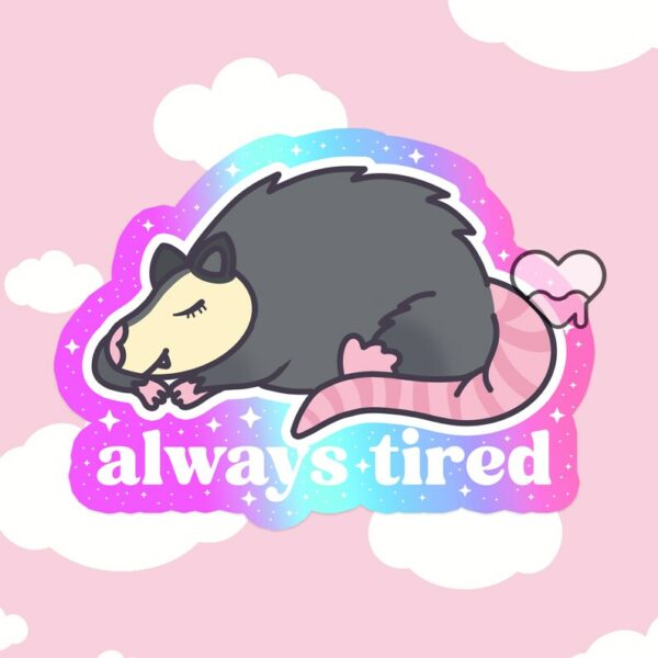 A graphic of Always Tired Possum Sticker available on HeckinMagical.com