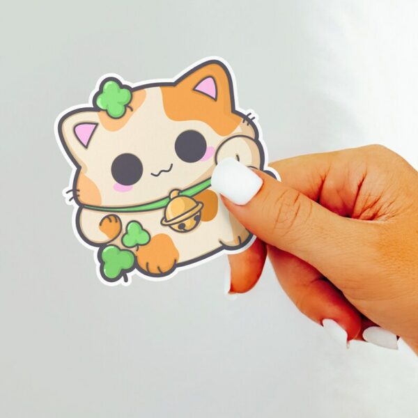 A graphic of Calico Shamrock Lucky Cat Sticker available on HeckinMagical.com