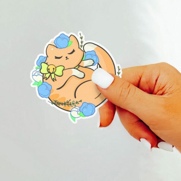 A graphic of Kawaii Floral Orange Cat Sticker available on HeckinMagical.com