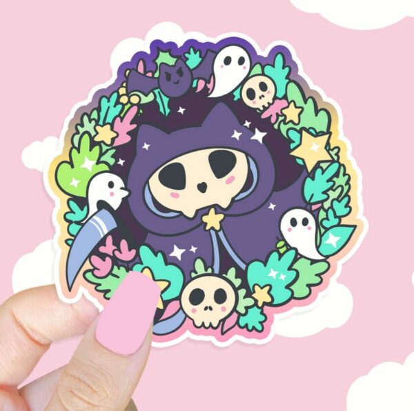 A graphic of Kitty Reaper Sticker available on HeckinMagical.com