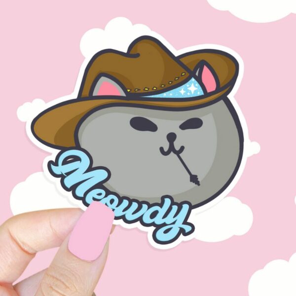 A graphic of Meowdy Meowboy Sticker available on HeckinMagical.com