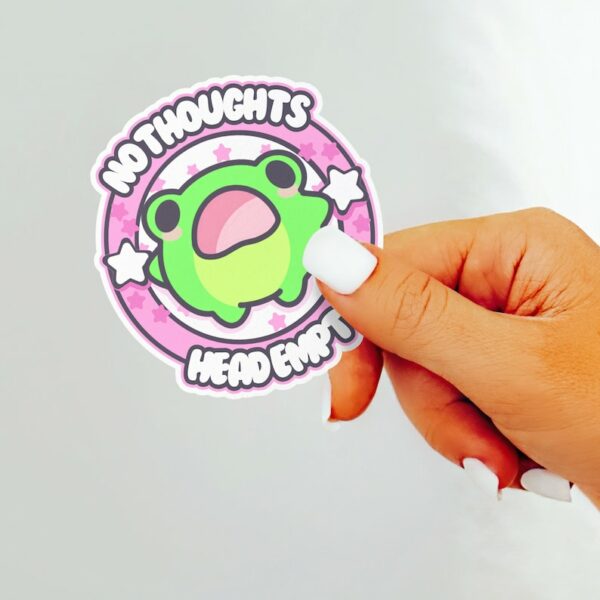 A graphic of No Thoughts Head Empty Frog Sticker available on HeckinMagical.com