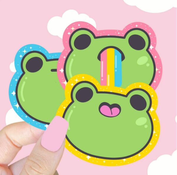 A graphic of Sparkle Frog Emoji Stickers available on HeckinMagical.com