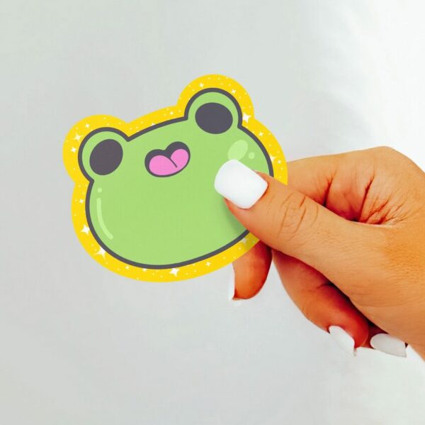 A graphic of Sparkle Frog Emoji Stickers available on HeckinMagical.com