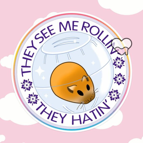 A graphic of They See Me Rolling Hamster Sticker available on HeckinMagical.com