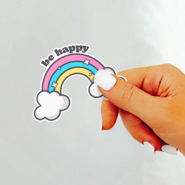 A graphic of Be Happy Rainbow Sticker available on HeckinMagical.com