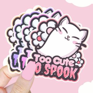 A graphic of Too Cute To Spook Cat Ghost Sticker available on HeckinMagical.com