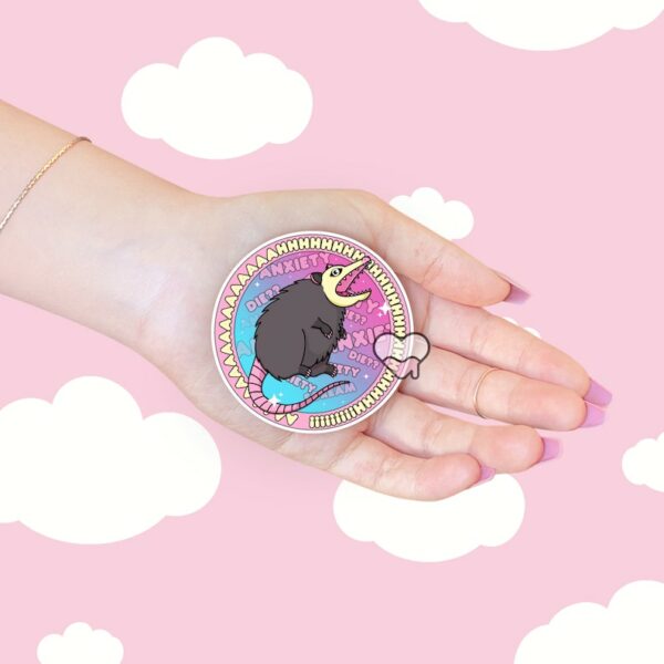 A graphic of Ahhh Anxiety Possum Round Sticker available on HeckinMagical.com