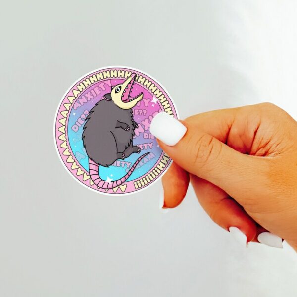 A graphic of Ahhh Anxiety Possum Round Sticker available on HeckinMagical.com