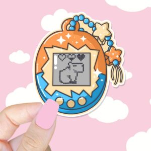 A graphic of Gamer Girl Handheld Pet Capybara Sticker available on HeckinMagical.com