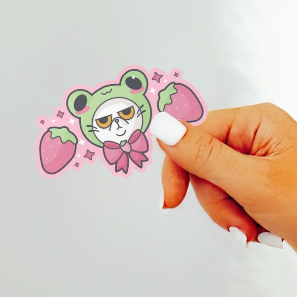 A graphic of Grompy Frog Cat Sticker available on HeckinMagical.com