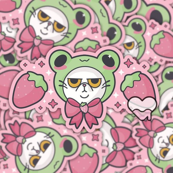 A graphic of Grompy Frog Cat Sticker available on HeckinMagical.com