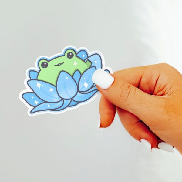 A graphic of Lotus Frog Blue Sticker available on HeckinMagical.com