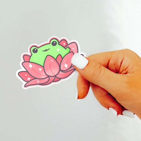 A graphic of Lotus Frog Pink Sticker available on HeckinMagical.com