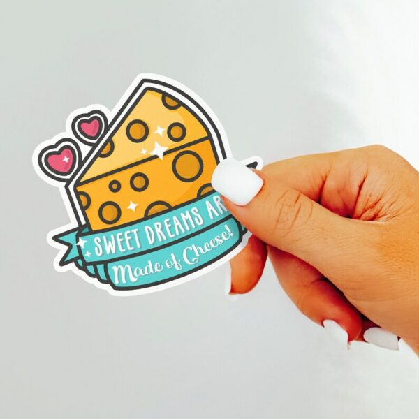 A graphic of Sweet Dreams Are Made Of Cheese Sticker available on HeckinMagical.com